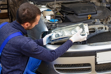 mechanic men with wrench repairing car engine at