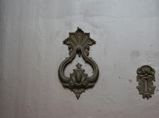 Ornate and decorative brass door knocker