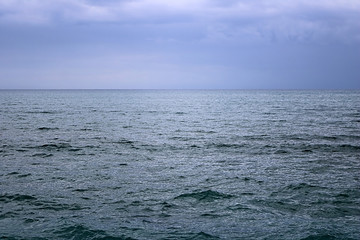 View of Mediterranean Sea with a cloudy blue sky after the rain. Waves and wind in Larnaca beach