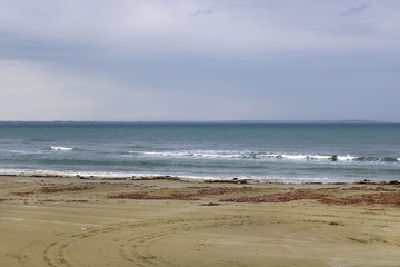 View of Mediterranean Sea with a cloudy blue sky after the rain. Waves and wind in Larnaca beach