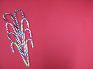 set colorful caramel cane blue lilac strips of red green over pink background