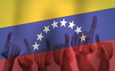 Protest Hands on the background of the Venezuela flag. Freedom concept