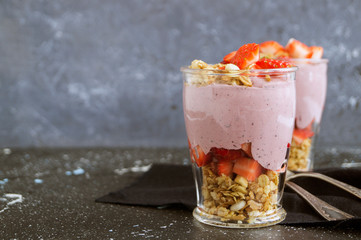 Homemade natural yogurt with strawberries and muesli.