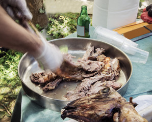 Easter lamb roasted on a spindle in a metal bowl