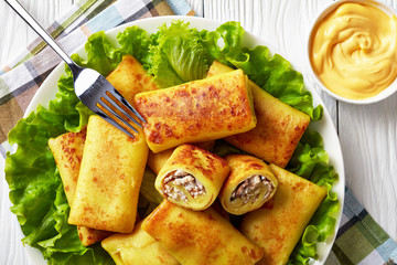 Savory crepe rolls with ground chicken meat