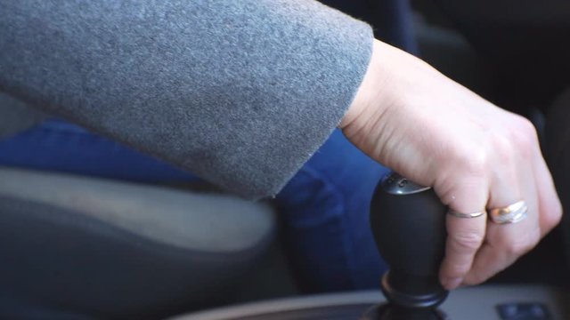 Women's hands shift gears with the gear lever. 1920X1080 Full Hd.