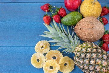 Tropical fruits on the wooden blue table