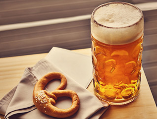 Sausages with potatoes and Pretzels Bavarian with a beer 