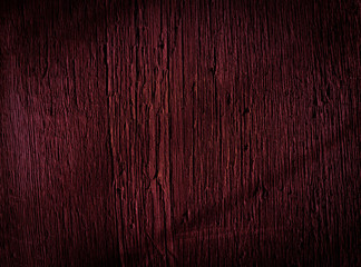 Texture of dark burgundy old rough wood. Mahogany abstract background for design. Vintage retro