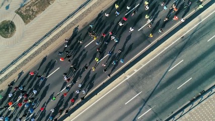 Marathon running on the road. Top view shot