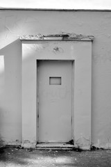 Black and white shoot of a closed door.