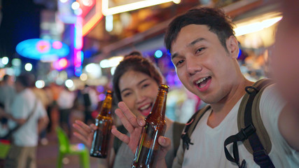 Traveler Asian blogger couple travel in Bangkok, Thailand, sweet couple using mobile phone make...