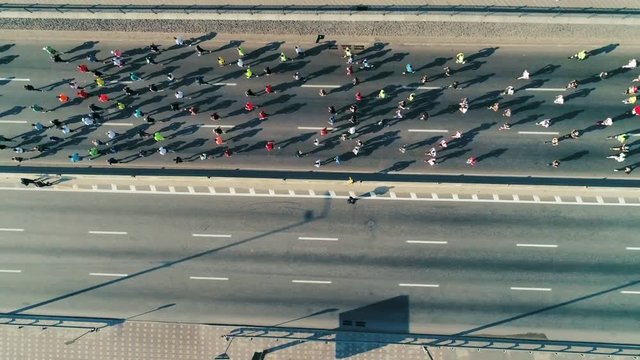 Marathon running on the road. Top view shot