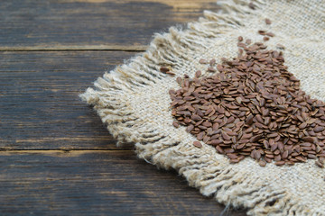 Flax seeds on a piece of linen cloth.