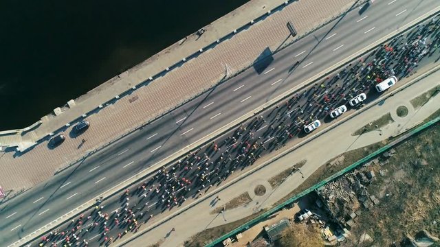 Marathon running along seafront at morning. Top view