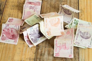 Turkish Liras paper on dirty wood background