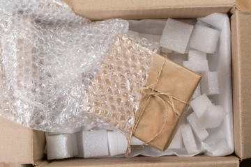 Packing products for delivery, shipping service. Delivery concept for private companies delivery with care , Craft present box