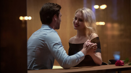 Lady of easy virtue seducing man with her passionate sight and look, desire