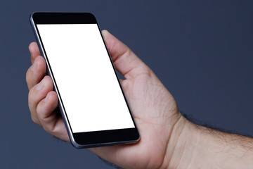 Hand holding cellphone with clear screen at isolated background
