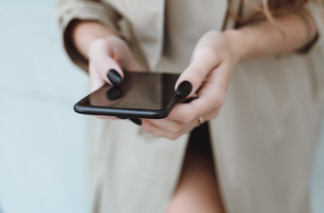 young pretty woman posing in the street with phone, outdoor portrait, hipster girls, sisters, chic, tablet, internet, using smartphone, close-up fashion model, post in instagram, facebook