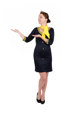 Stewardesse - Charming and smiling Stewardess Dressed In Blue Uniform Holding In Hand. Isolated on white backgroundv