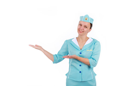 Stewardesse - Charming and smiling Stewardess Dressed In Blue Uniform Holding In Hand. Isolated on white background