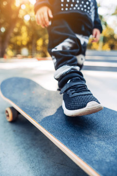 Boy legs on the skateboard close up image