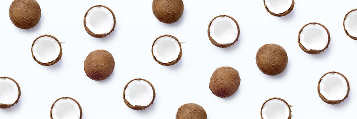 Pattern with ripe coconuts on white background. From top view. Banner