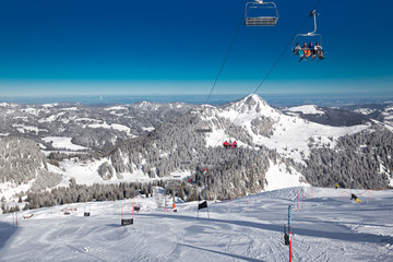 Beautiful winter landscape. People skiing in Hoch Ybrig ski resort, Switzerland, Europe.