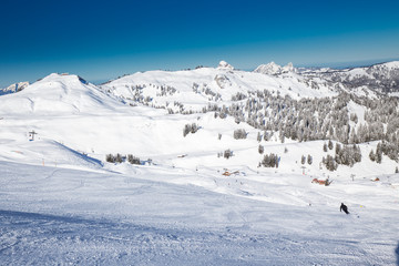 Beautiful winter landscape. People skiing in Hoch Ybrig ski resort, Switzerland, Europe.