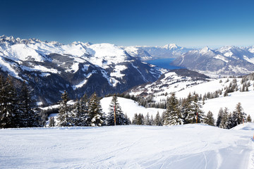Fototapeta premium Beautiful winter landscape. People skiing in Hoch Ybrig ski resort, Switzerland, Europe.