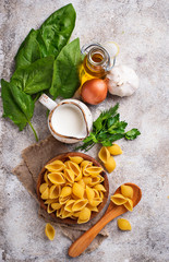 Ingredients for cooking  pasta with spinach