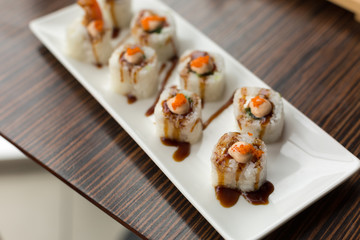 shrimp rolls. rolls on a white plate