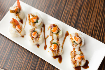 shrimp rolls. rolls on a white plate