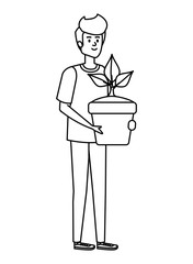 young man lifting houseplant in pot