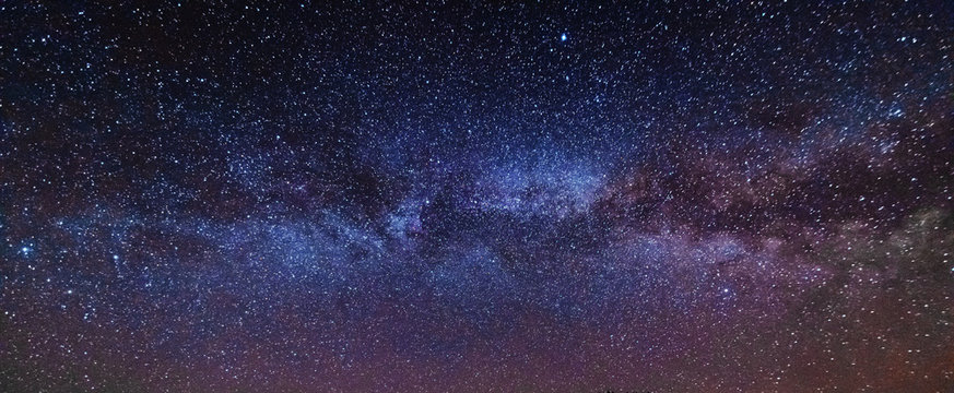 Fantastic starry sky with galaxy Milky way over mountainous masses of Ukrainian Carpathians