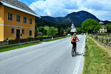 Austrian Alps-view on the cyclist in the Laas