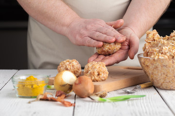 Obraz na płótnie Canvas chicken Meatballs with rice, cooking on kitchen