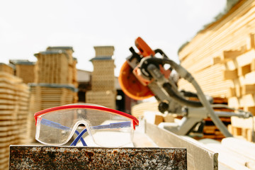 Construction glasses. Sawmill. Wood harvesting concept