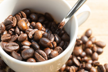 coffee beans in a white mug