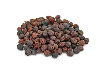 Dried medicinal herbs raw materials isolated on white. Fruit of Crataegus commonly called hawthorn, thornapple, May-tree, whitethorn, or hawberry. Cure for the heart.
