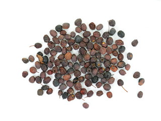 Dried medicinal herbs raw materials isolated on white. Fruit of Crataegus commonly called hawthorn, thornapple, May-tree, whitethorn, or hawberry. Cure for the heart.