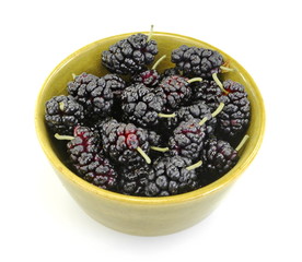 Ripe mulberries background. Mulberry - Morus - healthy fruit close up isolated on white background.