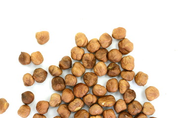 Heap of hazelnuts isolated on white background