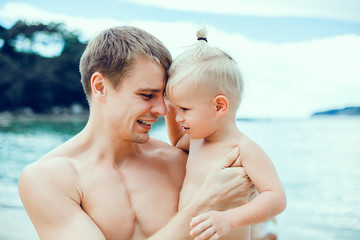 Happy family posing in the beach, Thailand, Bali