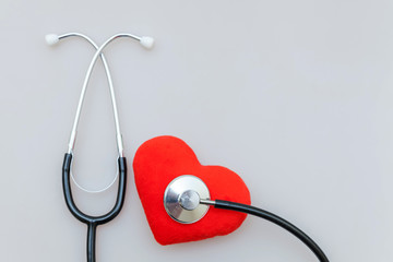 Simply minimal design with medicine equipment stethoscope or phonendoscope and red heart isolated...