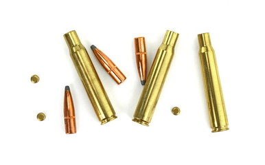 A rifle bullet, empty shell on white background.