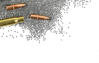 A rifle bullet with gun powder isolated on white.