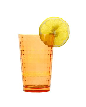 Empty transparent orange glass with lemon slice isolated on white background.