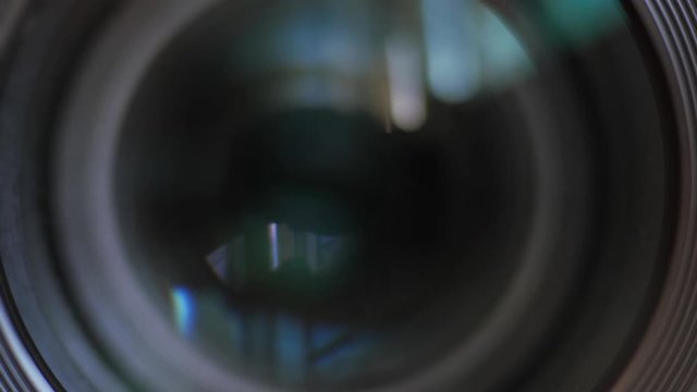 Closing the camera lens eye. Camera lens zoom. Changing focal length. Front view macro shot.